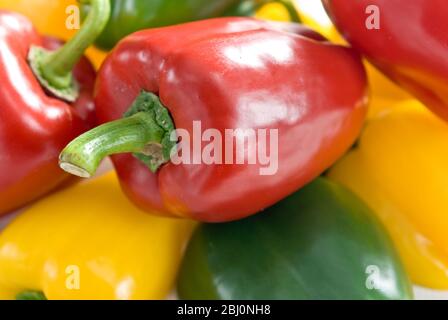 Red, green and yellow peppers - Stock Photo