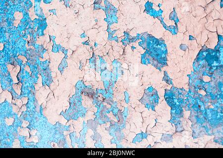 Texture concrete industrial background - pink and turquoise peeling paint on the old rough concrete surface, peeling paint texture Stock Photo