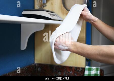 Chef preparing pizza dough on marble table, closeup Stock Photo