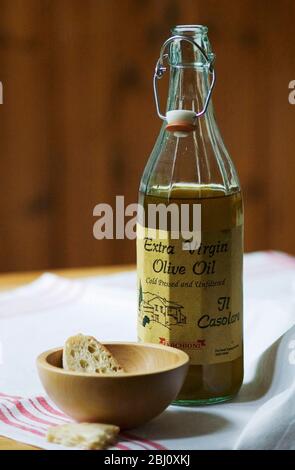 Extra virgin olive oil with rustic bread to dip in it - Stock Photo