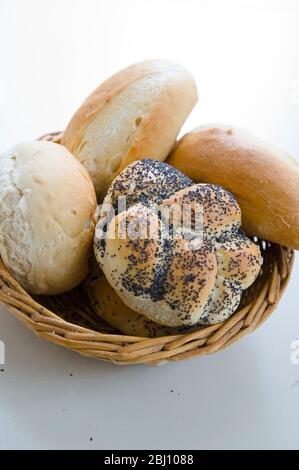 Bread basket with decorative bread rolls - Stock Photo