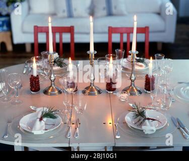 Table laid for Christmas dinner - scandinavian style - Stock Photo