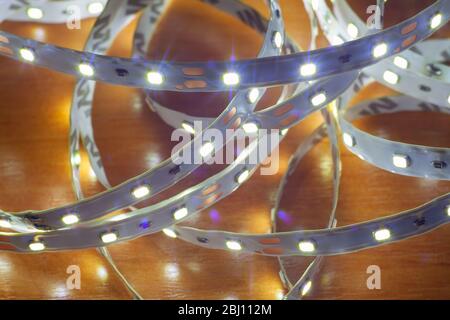 LED strip on a wooden table, close-up Stock Photo