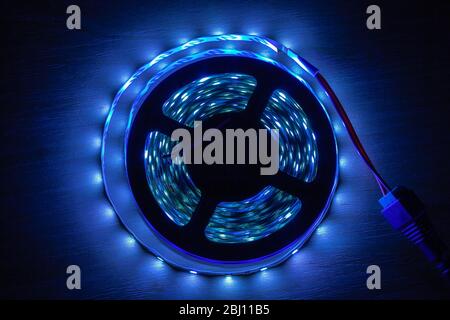 LED strip on a wooden table, close-up Stock Photo