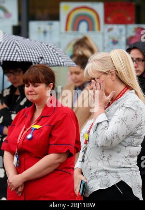 Derby, Derbyshire, UK. 28th April 2020. Royal Derby Hospital Staff and members of the public pause for a minuteÕs silence to remember key workers who have died because of Covid-19 during the coronavirus pandemic lockdown. Credit Darren Staples/Alamy Live News. Stock Photo