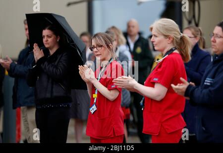 Derby, Derbyshire, UK. 28th April 2020. Royal Derby Hospital Staff and members of the public applaud after a minuteÕs silence to remember key workers who have died because of Covid-19 during the coronavirus pandemic lockdown. Credit Darren Staples/Alamy Live News. Stock Photo