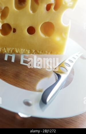 Modern cheeseeboard with selection of cheeses - Stock Photo