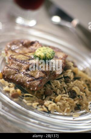 Escalopes on rice - Stock Photo