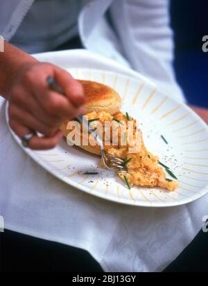 Eating scrambled eggs - Stock Photo