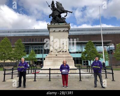 Unison representatives Joe McAtominey, Linda Hobson and Michael Barclay before they laid two wreaths at the War Memorial in Old Eldon Square, Newcastle, for key workers in the fight against Covid-19. Stock Photo