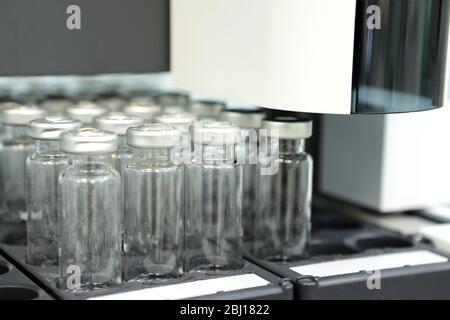 Quality Control Laboratory medicine. Chromatograph operation. Bottles check on the quality of the suspension. Stock Photo