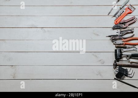 tools for repairs lies on the white boards Stock Photo