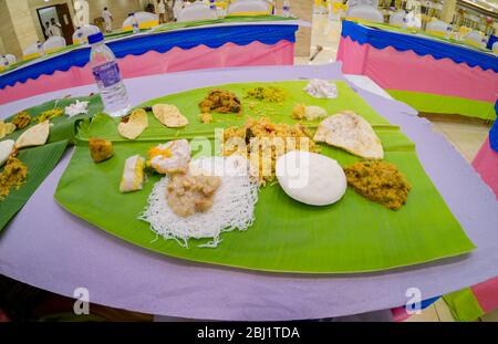 Food served on a banana leaf at a South-Indian Wedding Stock Photo