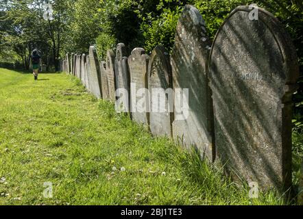 Gravestones in the grounds of St Mary the Virgin church in Micheldever, Hampshire, England, UK Stock Photo