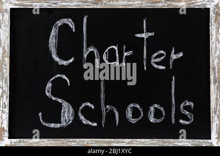 Charter Schools written on chalkboard Stock Photo
