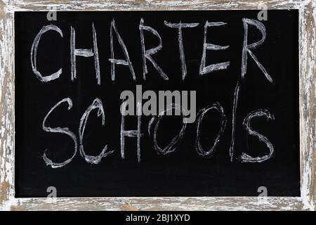 Charter Schools written on chalkboard Stock Photo