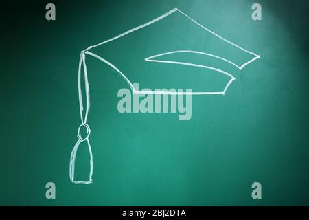 Bachelor hat drawing on blackboard background Stock Photo