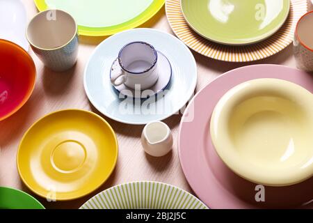 Set of colourful plates on the table Stock Photo