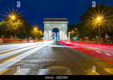 Paris, France - September 15, 2018: Arc de Triomphe Triumphal Arch in Champs Elysees at night, Paris, France with traffic abstract lights. Glowing Stock Photo