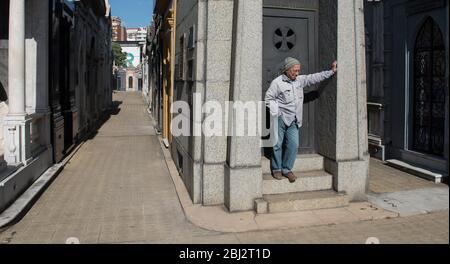 Buenos Aires, Argentina - May 03 2016: Employee of the recoleta cemetery resting and sunbathing Stock Photo