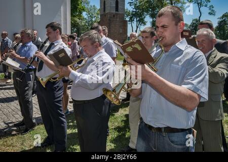 Village orchestra playing at Sunday Mass at Norbertine Church in Witow, village near Piotrkow Trybunalski, Western Mazovia, Poland Stock Photo