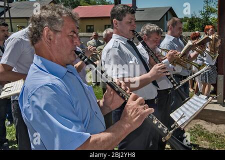 Village orchestra playing at Sunday Mass at Norbertine Church in Witow, village near Piotrkow Trybunalski, Western Mazovia, Poland Stock Photo