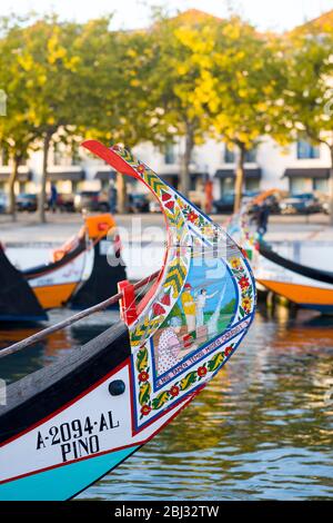 Traditional brightly painted gondola style moliceiro canal boat with painted prow in Aveiro, Portugal Stock Photo