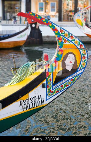 Traditional brightly painted gondola style moliceiro canal boat with painted prow in Aveiro, Portugal Stock Photo