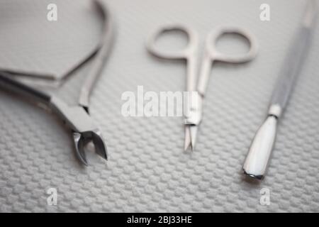 Set of tools for manicure on the white table closeup. Stock Photo