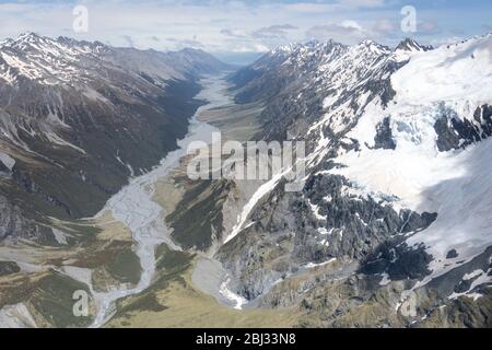 aerial, from a glider, with snow landslides of Selwyn glacier and Dobson river valley, shot in bright spring light from north, Canterbury, South Islan Stock Photo