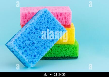 sponges for dishwashing on a blue background. Stock Photo