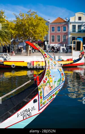 Traditional brightly painted gondola style moliceiro canal boat with scene painted on prow in Aveiro, Portugal Stock Photo