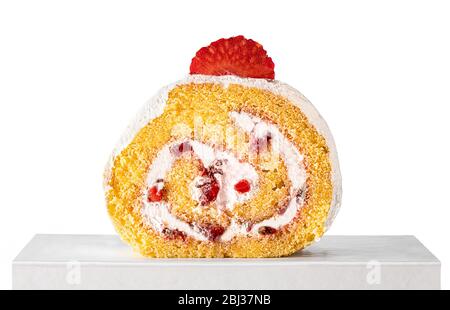 Piece of strawberry cake roll on white background. Stock Photo
