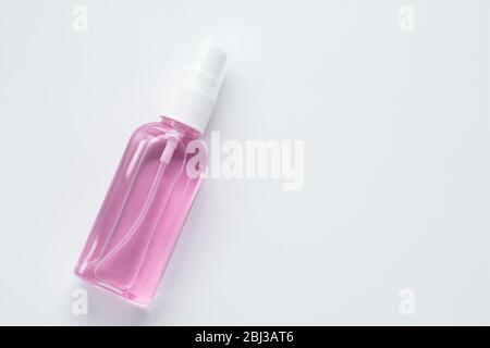 Hand sanitizer bottle on white background. Coronavirus (covid-19) prevention concept. Copy, text space. Antiseptic spray for disinfection Stock Photo