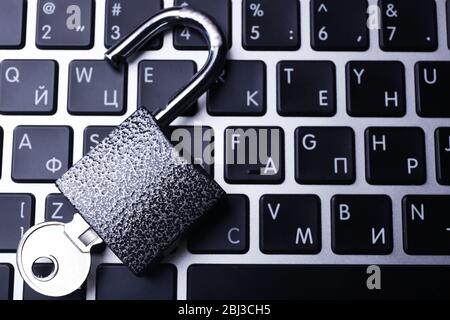 Lock on the laptop keyboard background, close up Stock Photo