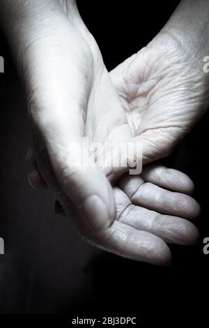 Hands of elderly woman doing a selfmassage. Manual physiotherapy Stock Photo