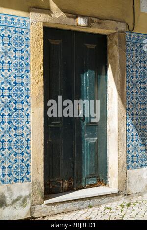 Typical doorway and Portugese Azulejos tiles near Calcada in Lisbon, Portugal Stock Photo