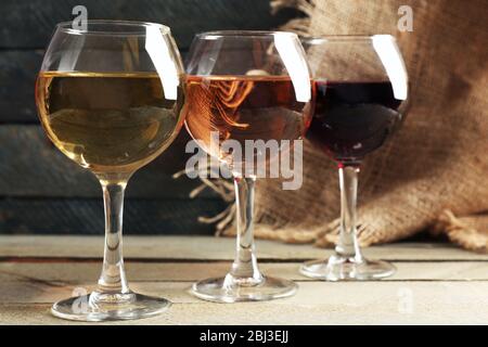 Composition of wine glasses on wooden background Stock Photo