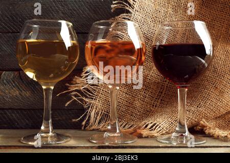 Composition of wine glasses on wooden background Stock Photo