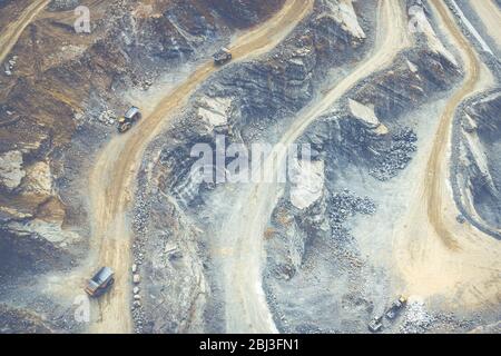 Mining from above. Industrial terraces on open pit  mineral mine. Aerial view of opencast mining. Dolomite Mine Excavation. Extractive industry. Giant Stock Photo