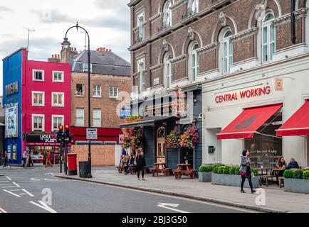 London / UK - September 9 2015: The junction of Bayley st. and Tottenham Court Road, with restaurants, pubs and cinemas Stock Photo