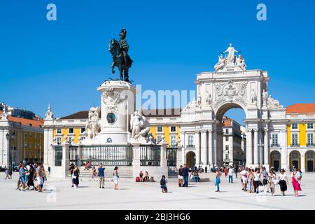 Tourists photographing bronze statue of Jose I on horseback - Portugal's king in Praca do Comercio -Terreiro do Pao, in Lisbon, Portugal Stock Photo