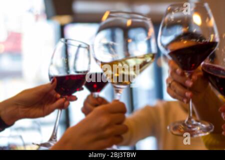 Abstract blur. Glasses of wine on the table in the restaurant. The concept of success Stock Photo