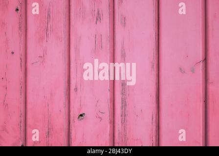 Pink pastel color background of aged wood with vertical planks. Stock Photo