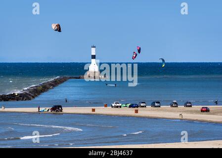 Kitesurfing at Conneaut West Breakwater Lighthouse on Lake Erie. Stock Photo