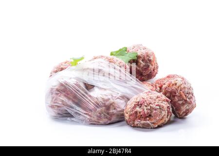 frozen raw meatballs from beef and pork with carrots and rice Stock Photo