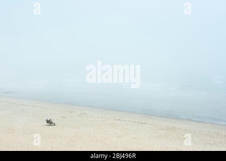 Senior couple enjoy the waterfront view from Long Nook Beach at Truro in Cape Cod. Stock Photo