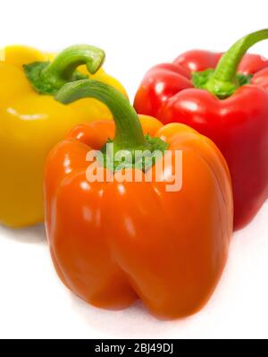 Close up of three bell peppers, each a different color. Stock Photo