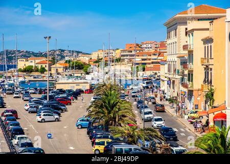 La Maddalena, Sardinia / Italy - 2019/07/17: Panoramic view of La Maddalena port quarter - Porto di Cala Gavetta - at the Via Amendola street Stock Photo