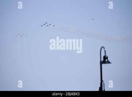 Jersey City, United States. 28th Apr, 2020. US Navy Blue Angels and US Air Force Thunderbirds fly in formation over New Jersey and New York City on Tuesday, April 28, 2020. A formation of US Navy Blue Angels and US Air Force Thunderbirds honor first responders on the front lines of the coronavirus pandemic by flying over New York, New Jersey and Pennsylvania. Photo by John Angelillo/UPI Credit: UPI/Alamy Live News Stock Photo